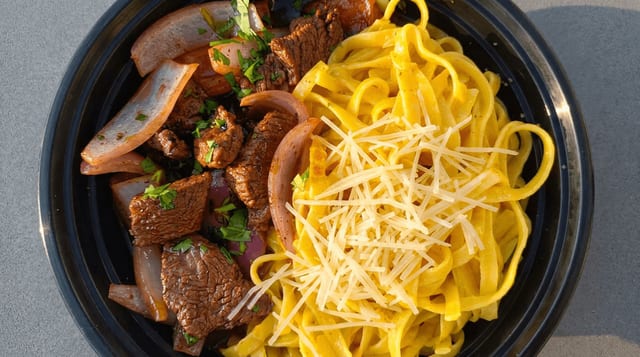 Huancaína Fettuccini with Lomo Saltado.
